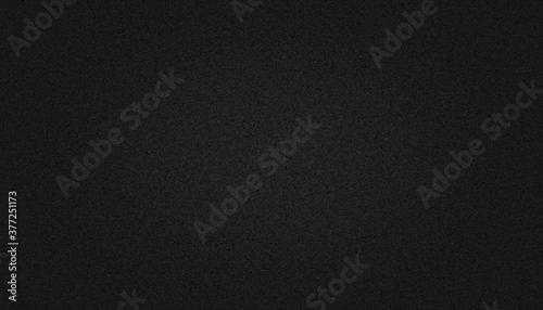 Black paper texture background with soft glowing backdrop, background texture for design