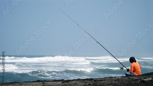 Man fishing in the sea alone
