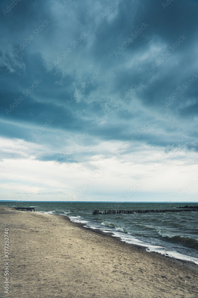 Storming sea with dark clouds in the autumn's morning. Sea landscape. Storming sea with dark clouds in the autumn's morning. Sea landscape.