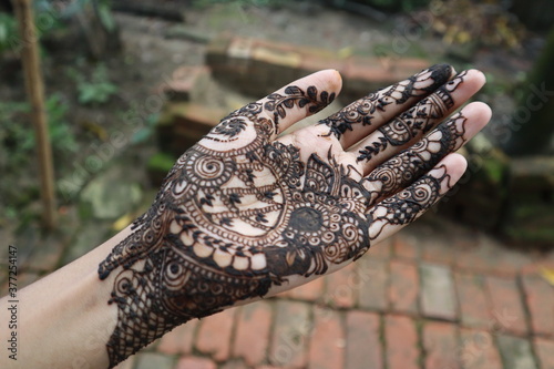 Ladies hand  with Mehendi tattoo 