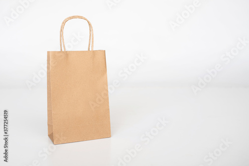 Kraft paper shopping bag for branding mockup on white background