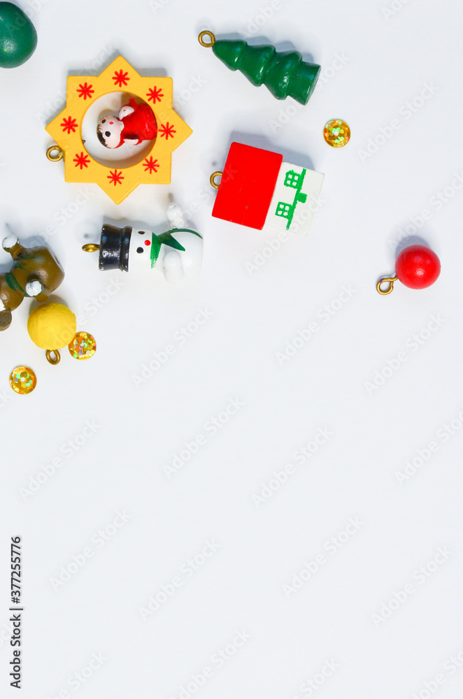 Fototapeta premium Christmas decoration small wooden toys for christmas tree on white background