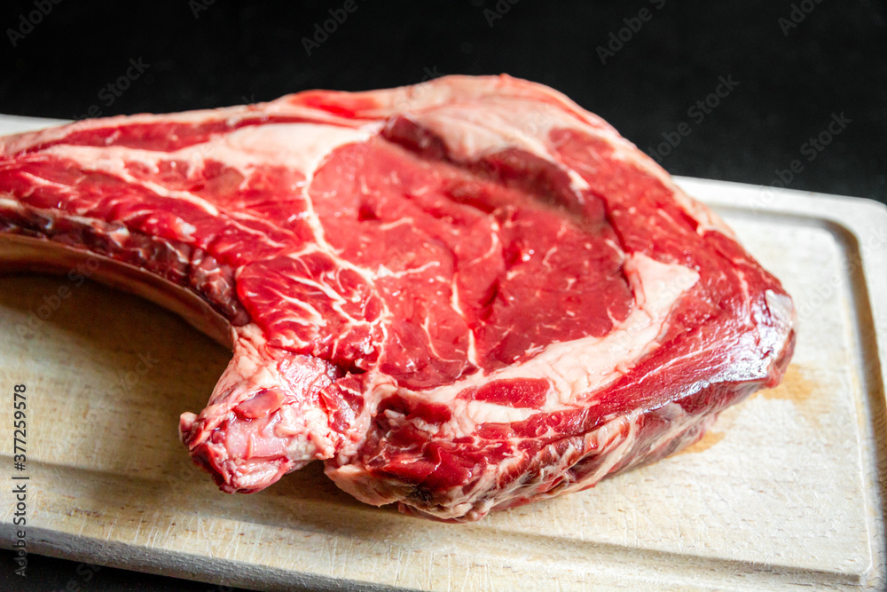 Beef prime rib on a cutting board Beef prime rib on a cutting board