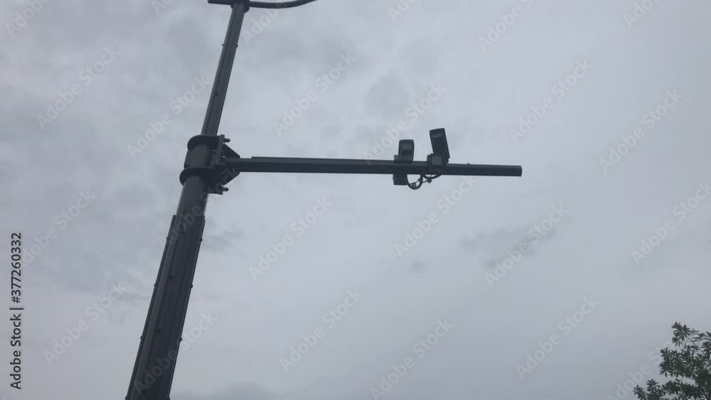 Silhoutte images of security camera or cctv video surveilance at outdoor which is technology system for spy or observe people or building that need protection guard or privacy area in Shanghai China Silhoutte images of security camera or cctv video surveilance at outdoor which is technology system for spy or observe people or building that need protection guard or privacy area in Shanghai China