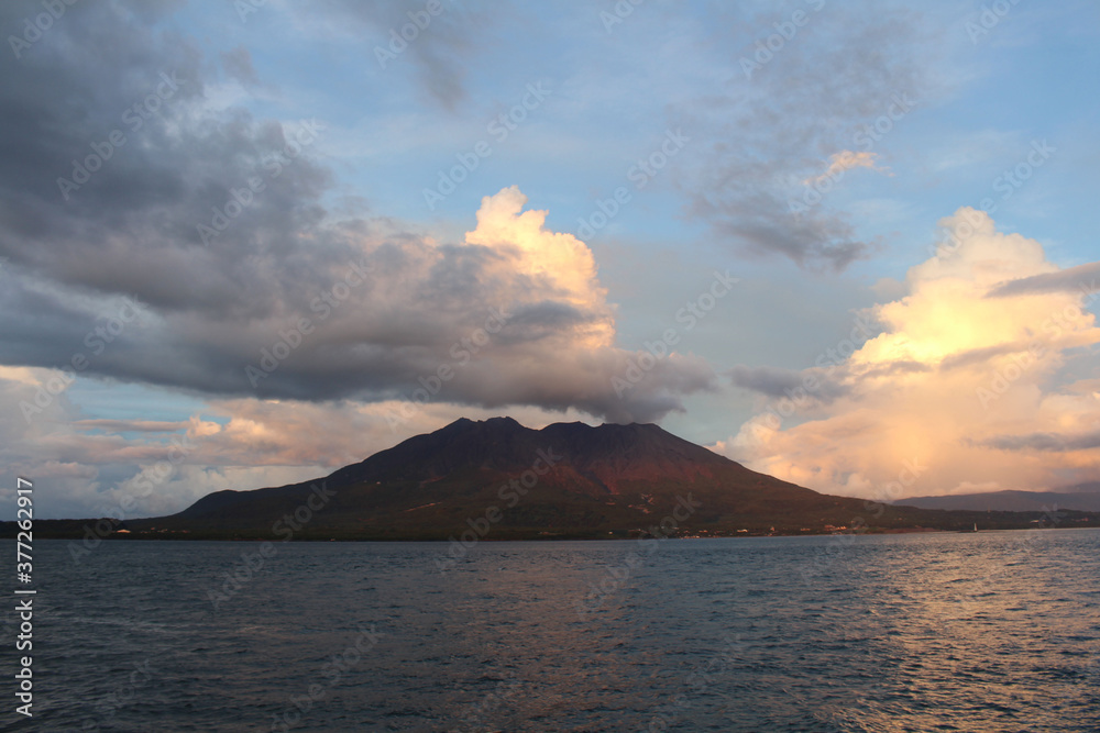 Sakurajima getting dark around Kamoikekaizuri Park during sunset