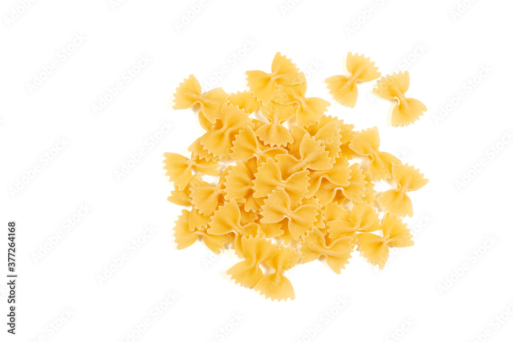 Uncooked farfalle pasta isolated on white background. Top view Uncooked farfalle pasta isolated on white background. Top view
