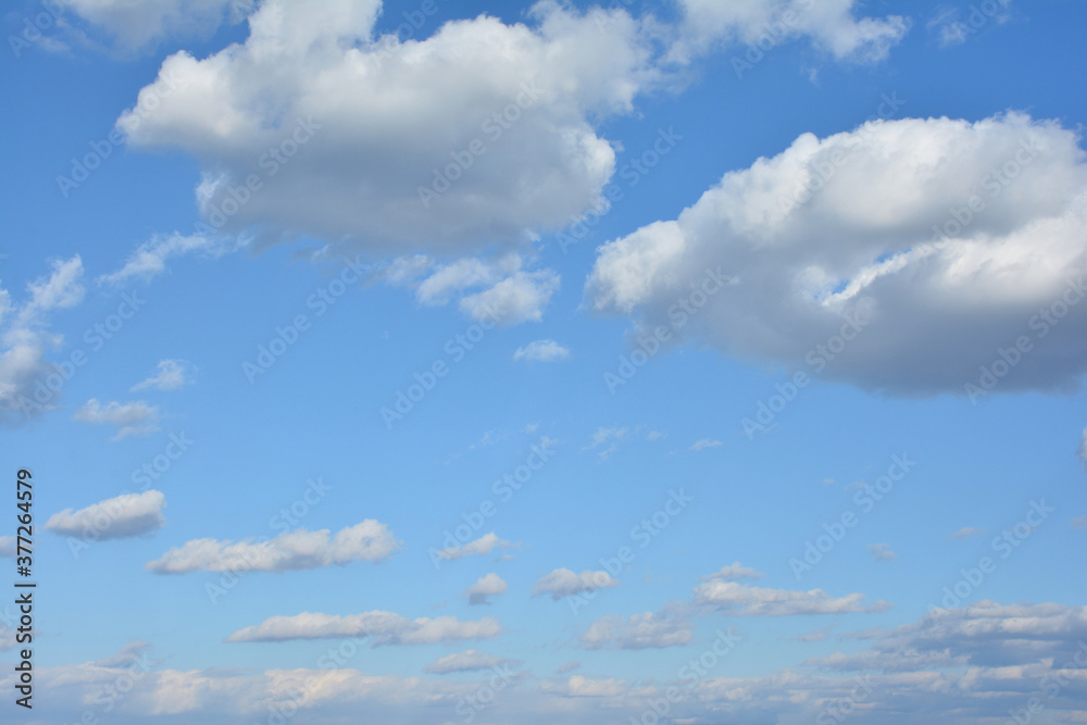 Blue Sky With Scattered Clouds With A Sun Blue Sky With Scattered Clouds With A Sun