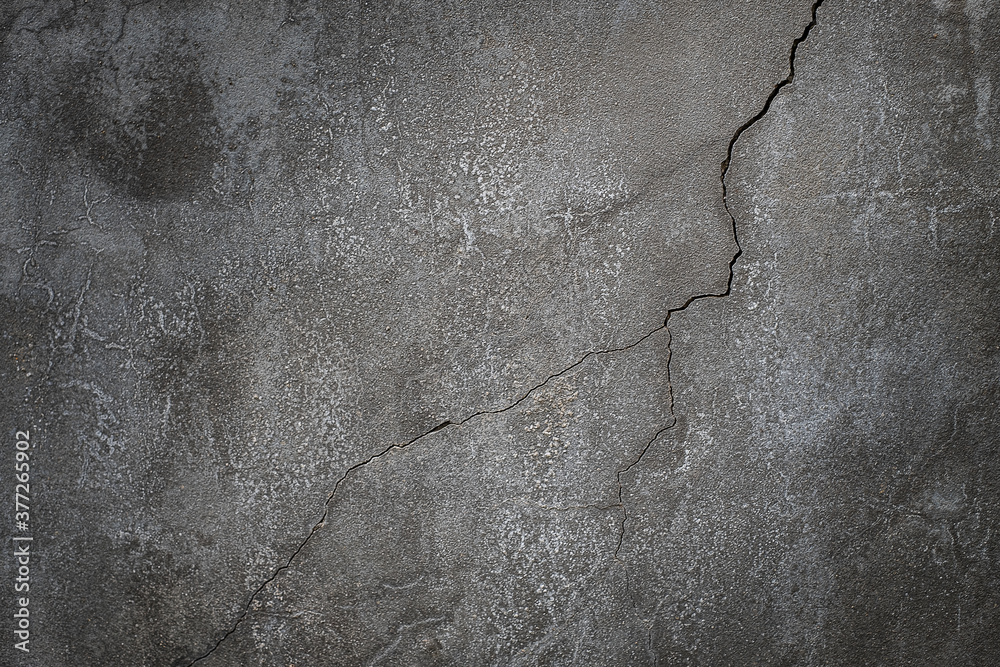 Fototapeta premium Concrete cement wall with a crack for design and texture background