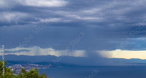 Dramatic storm scenery over the Adriatic Sea  with dark cumulus rain clouds