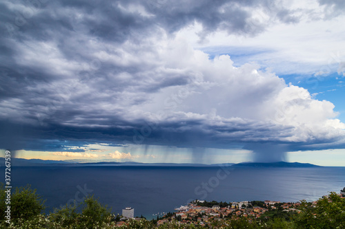 Dramatic storm scenery over the Adriatic Sea, with dark cumulus rain clouds