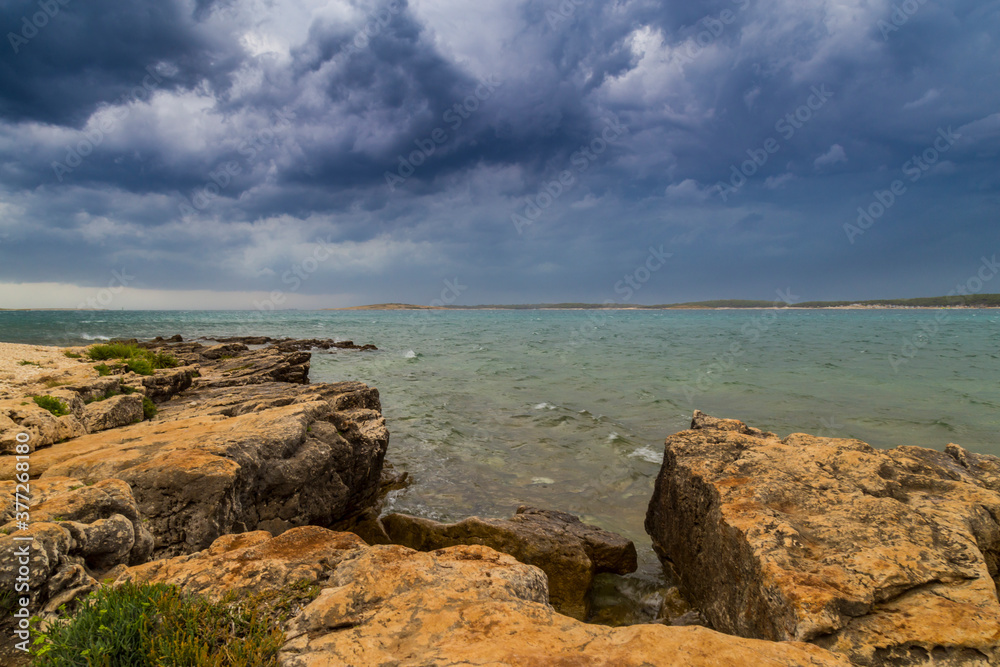 Dramatic storm clouds and rain over the Adriatic Sea in summer