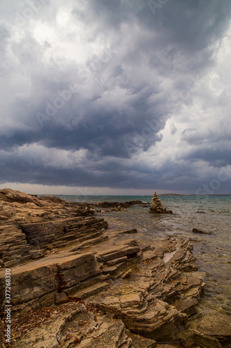 Dramatic storm clouds and rain over the Adriatic Sea in summer