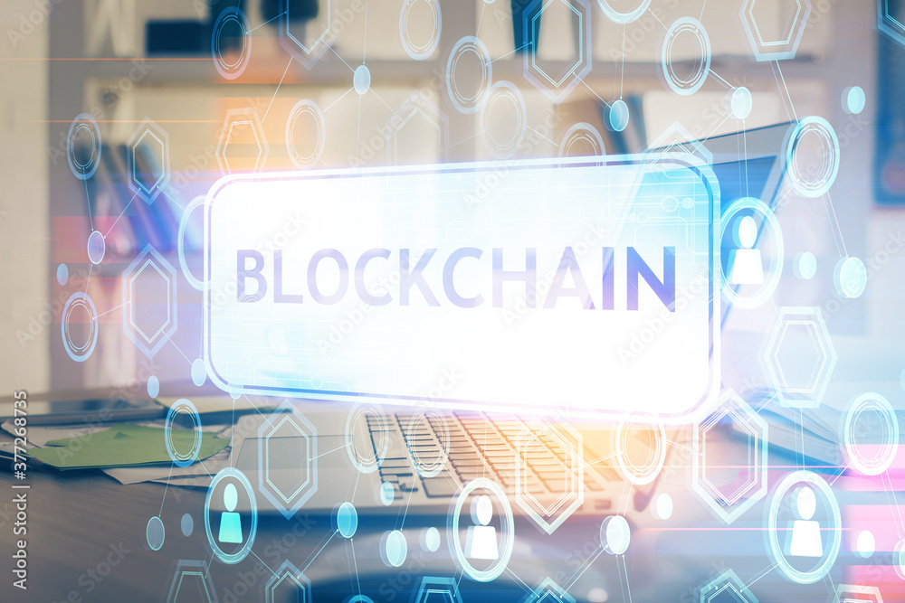 Multi exposure of blockchain theme hologram and table with computer background. Concept of bitcoin crypto currency. Multi exposure of blockchain theme hologram and table with computer background. Concept of bitcoin crypto currency.