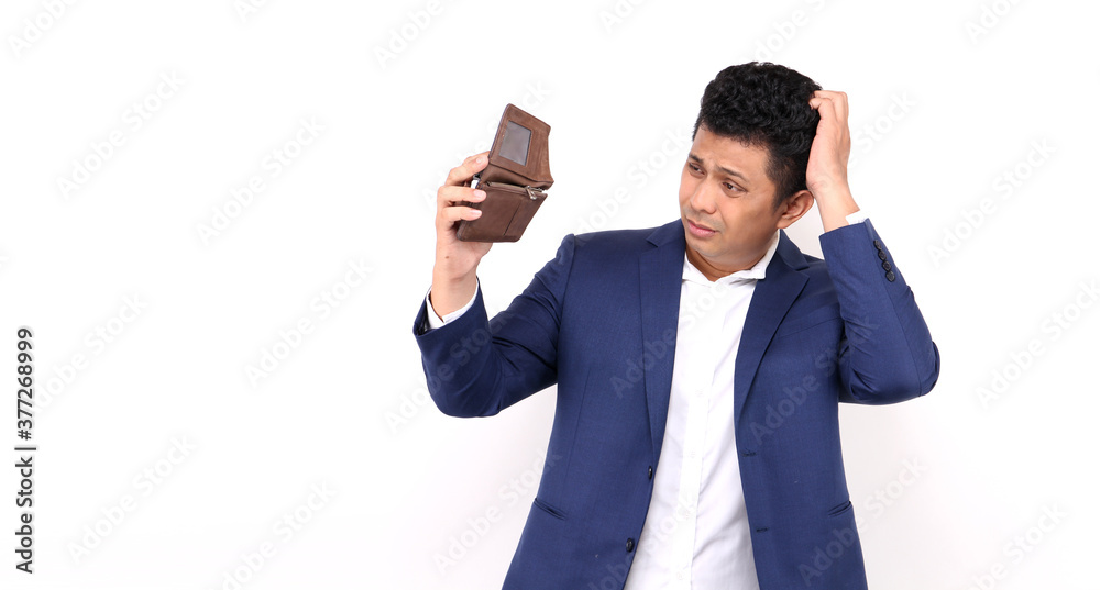 Business Asian man of a shocked surprised speechless holding an empty wallet on white background in studio With copy space. Business Asian man of a shocked surprised speechless holding an empty wallet on white background in studio With copy space.