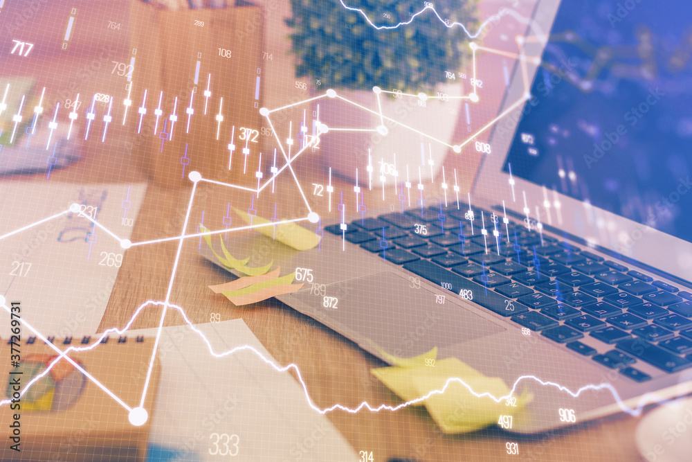 Multi exposure of chart and financial info and work space with computer background. Concept of international online trading. Multi exposure of chart and financial info and work space with computer background. Concept of international online trading.