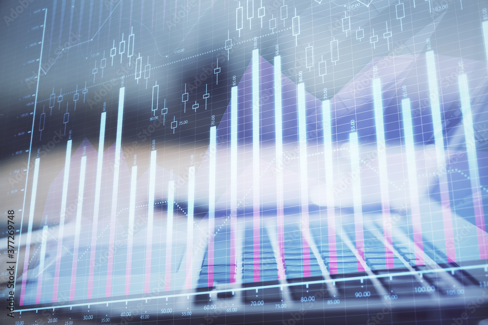 Financial market graph hologram and personal computer on background. Double exposure. Concept of forex. Financial market graph hologram and personal computer on background. Double exposure. Concept of forex.