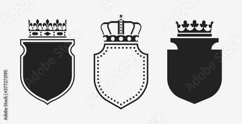 Set of crowns with shields. Black heraldic decoration vector elements.