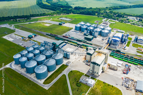 Production of sustainable fuel called bio gas. New factory in field. View from above. Ecological production. photo