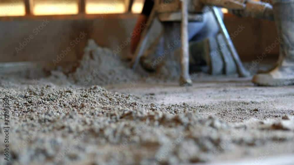 Concrete pump. Leveling sand and cement screed over floor heating Concrete pump. Leveling sand and cement screed over floor heating