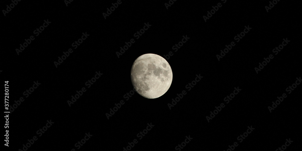 a half moon shining in black night a half moon shining in black night