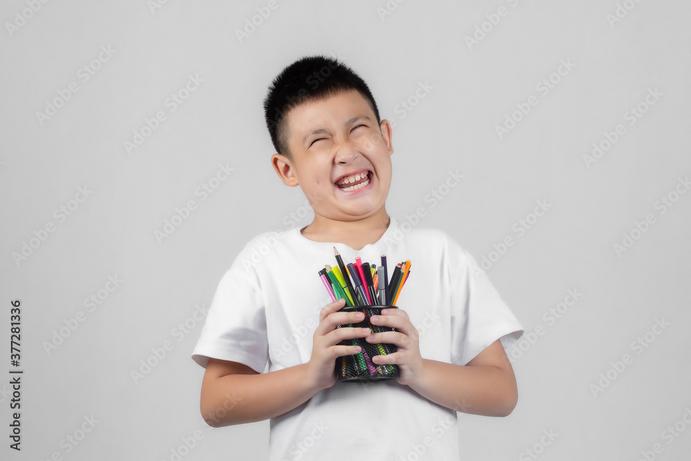Asian boys studio shot portrait on gray background Asian boys studio shot portrait on gray background