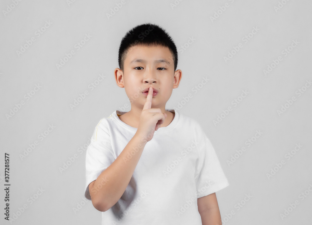Asian boys studio shot portrait on gray background Asian boys studio shot portrait on gray background
