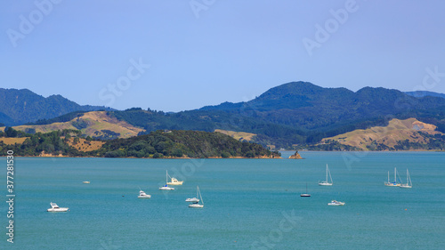Panoramic view of Coromandel Harbour, New Zealand, with many yachts on the water. in the background are the mountains of the Coromandel Range © Michael
