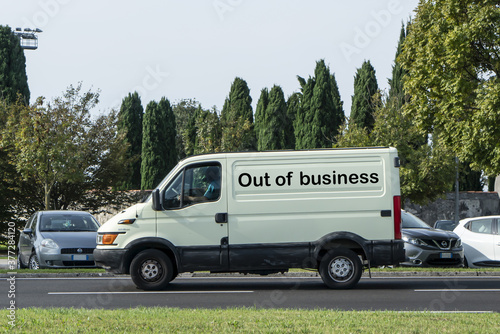 A commercial van with Out of Business written on the side in the pandemic period.