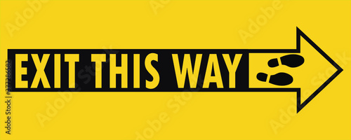 Social distancing concept for preventing coronavirus covid-19 with wording exit this way in black and arrow on yellow black background. warning or caution sign.   