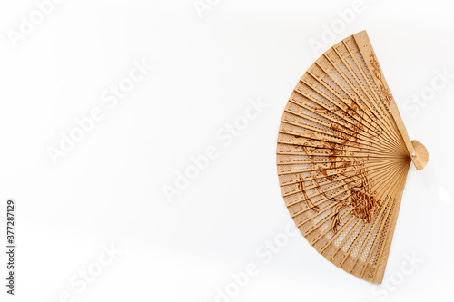The concept Bamboo fan on white background top view copy space