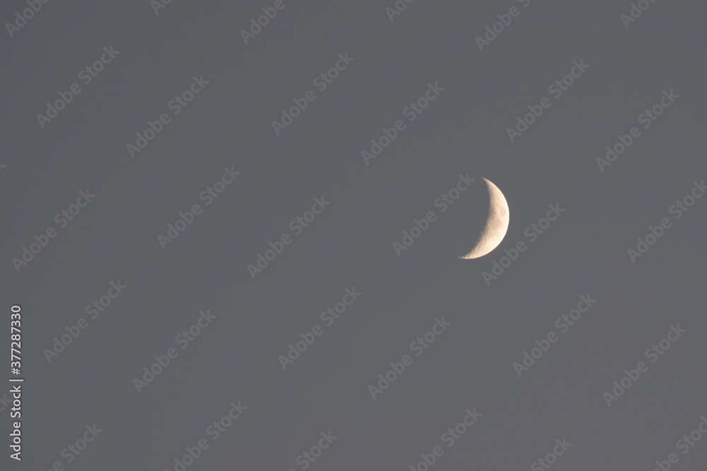 Crescent Moon. Moon in Clouds. The Background of the Moon in the Starry Sky. Moonlight in the Night Sky. Crescent Moon. Moon in Clouds. The Background of the Moon in the Starry Sky. Moonlight in the Night Sky.