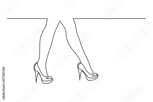 Women legs on high heels in continuous line art drawing style. Minimalist black linear sketch isolated on white background. Vector illustration
