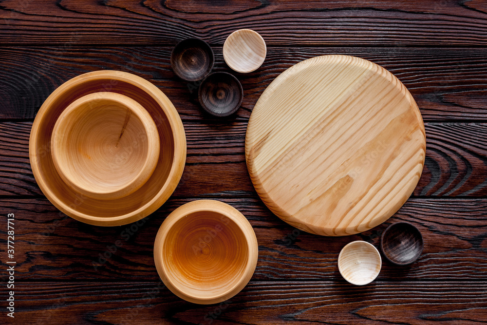 Making wooden dishes. Empty bowls on brown wooden background top view copy space Making wooden dishes. Empty bowls on brown wooden background top view copy space