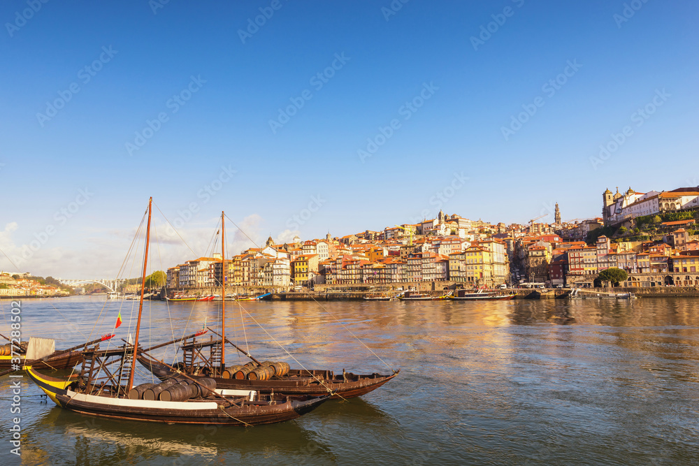 Porto Portugal city skyline at Porto Ribeira and Douro River with Rabelo wine boat