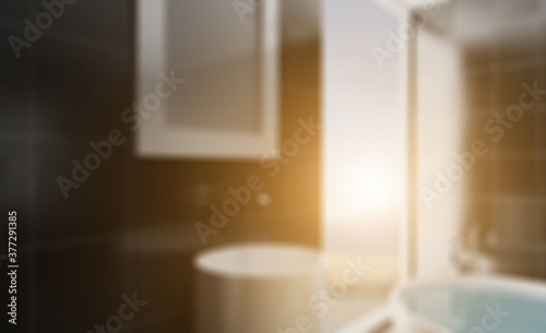 Spacious bathroom in gray tones with heated floors  freestanding tub. 3D rendering.. Abstract blur phototography