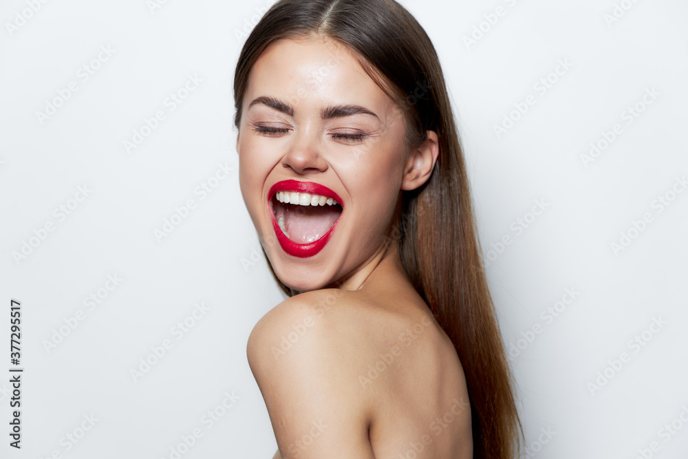 Woman portrait Naked shoulders wide open mouth closed eyes studio red lips 