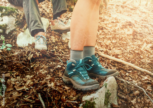  Close up of women legs wearing hiking boots