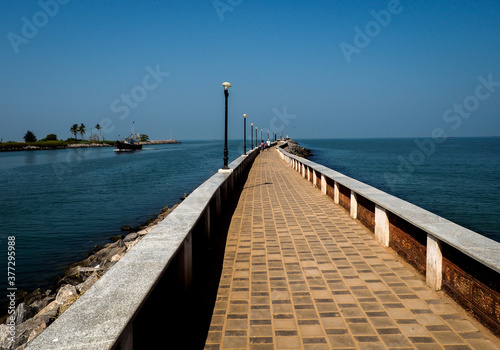 Long and beautiful almost neverending pier pointing to the sea. Malpe  Karnataka  India.