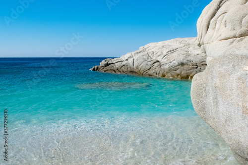Different colors and textures of blue water in the Seychelles beach of Ikaria