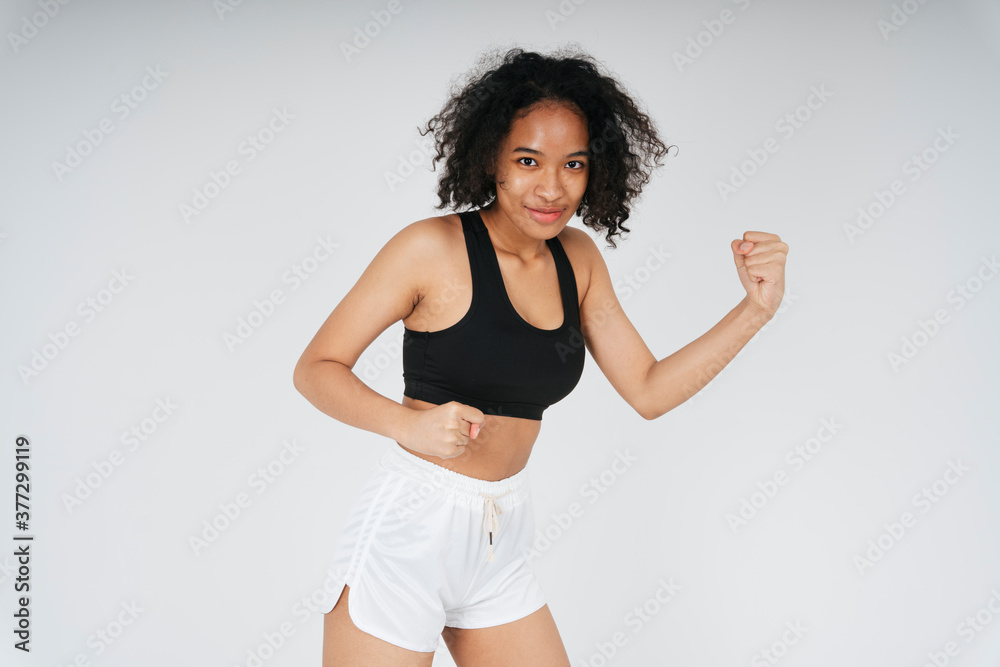 Portrai of mixed race african and thai woman in black sport bra. Portrai of mixed race african and thai woman in black sport bra.