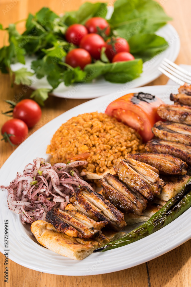 Turkish cuisine chicken wings grill. Grilled chicken wings on wooden background