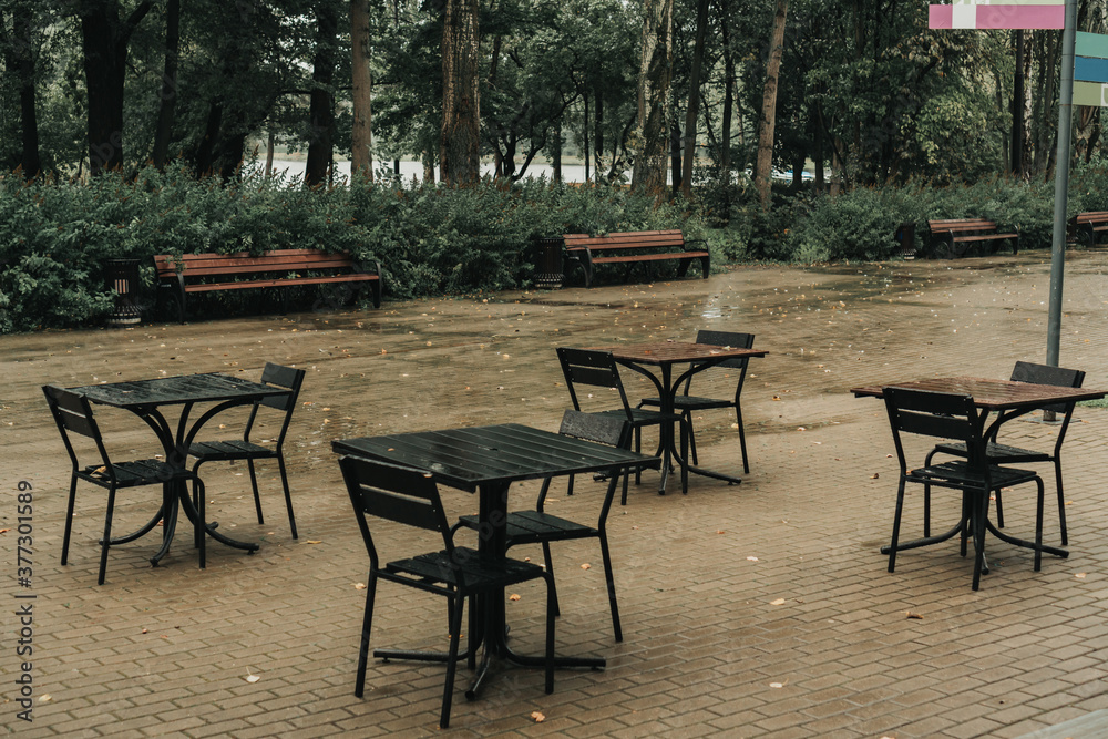 empty tables in the autumn park