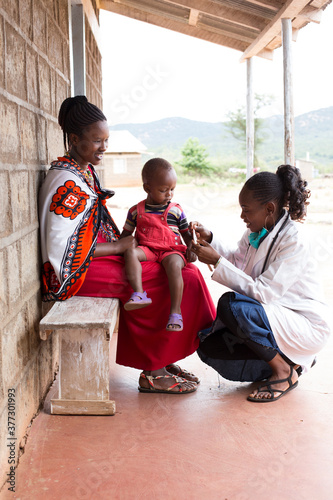 Doctor examining boy in clinic