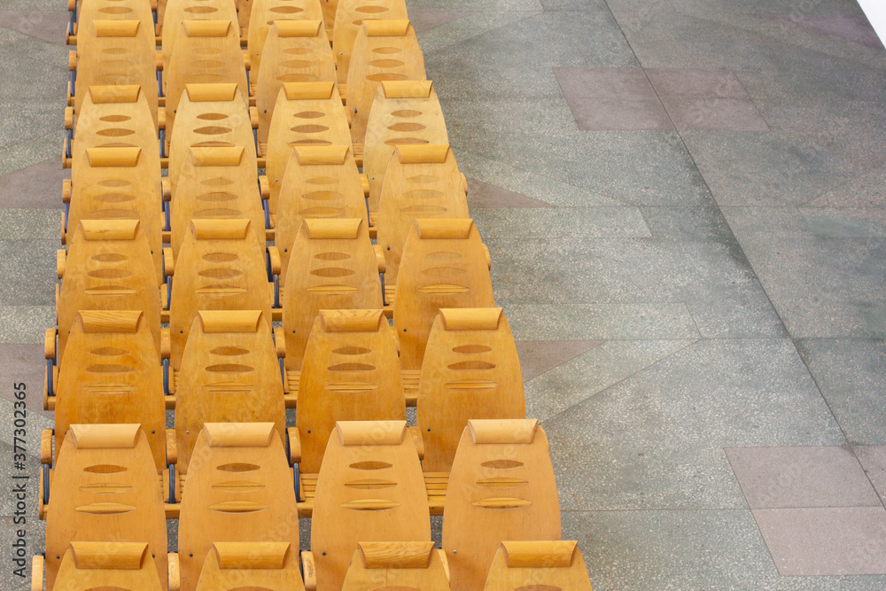 Fototapeta premium Row of yellow chair in the waiting room railway station, Russia