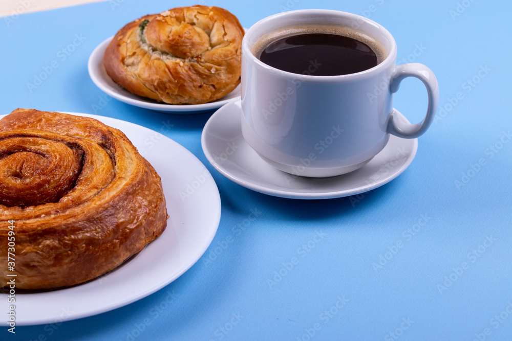 a cup of espresso and cinnamon roll a cup of espresso and cinnamon roll