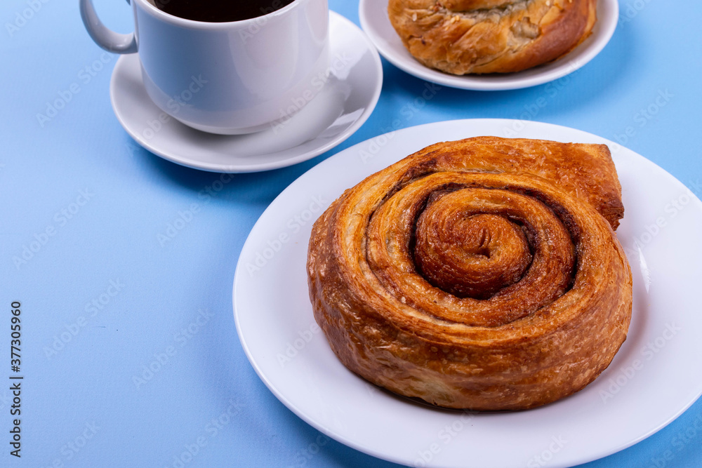 a cup of espresso and cinnamon roll a cup of espresso and cinnamon roll