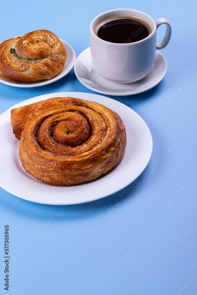 a cup of espresso and cinnamon roll a cup of espresso and cinnamon roll