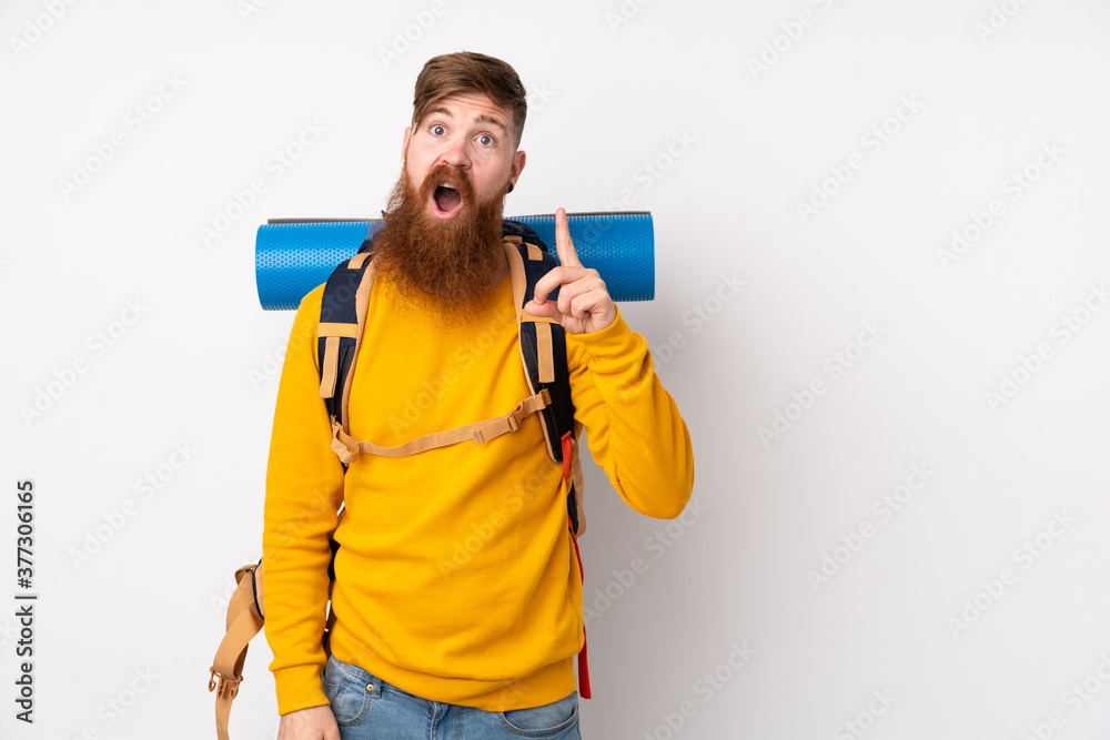 Young mountaineer man with a big backpack over isolated white background pointing with the index finger a great idea Young mountaineer man with a big backpack over isolated white background pointing with the index finger a great idea
