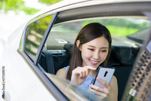 businesswoman use phone in car