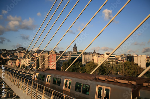 Golden Horn Metro Bridge in Istanbul City, Turkey. Galata Tower photo